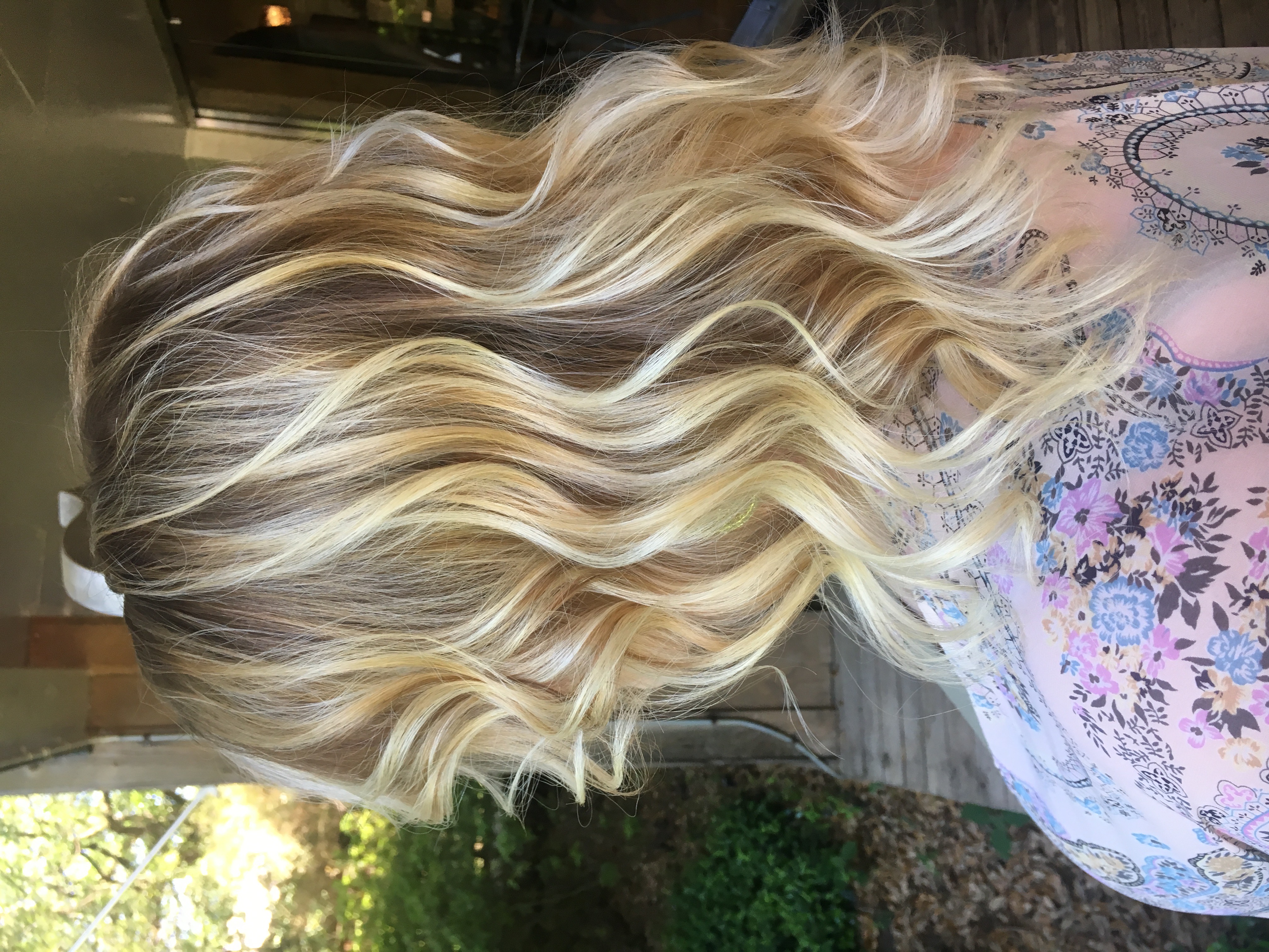 Picture of woman with blonde, balayage highlights.